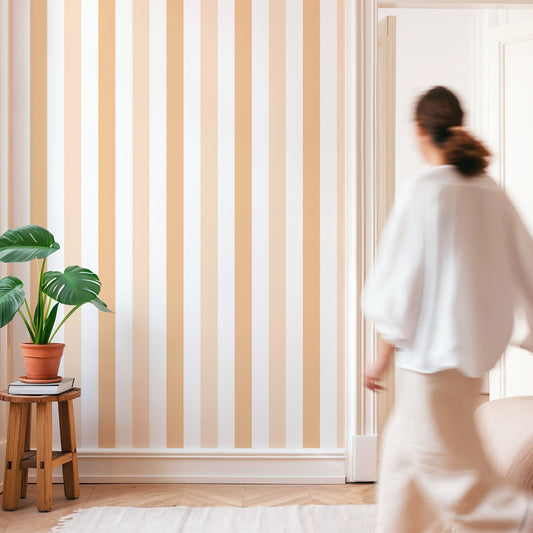Minimalist room with Orange Stripes Wallpaper and a woman walking by.
