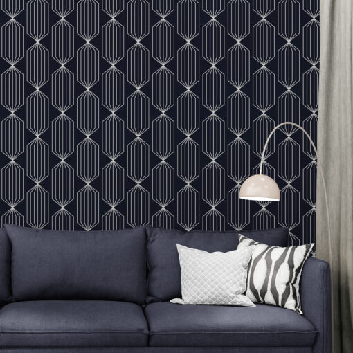 Dark navvy blue wallpaper with white lines in living room corner with sofa and lamp