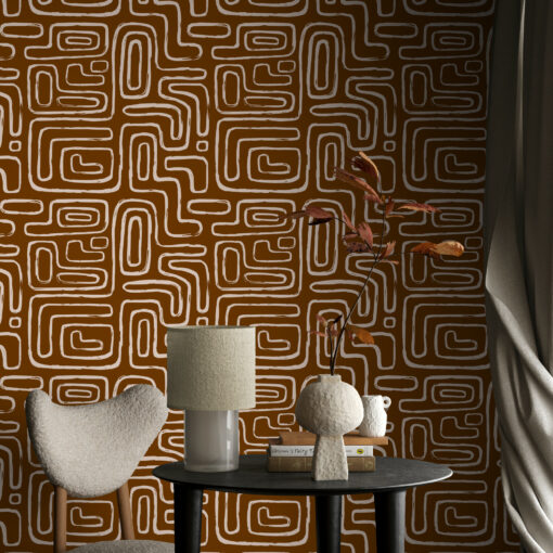 orange brown organic line art wallpaper in room corner with table and chair