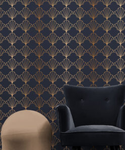 Blue and brown art deco wallpaper on wall behind armchair and fancy spherical stool