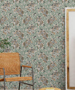 Green tropical cheetah wallpaper in studio room with orange chair and canvas panels