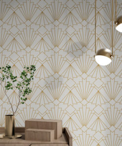 White and gold art deco wallpaper on wall behind a plant on a modern wooden cabinet